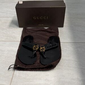 Women’s Gucci Black Leather Sandals with Gold Accents